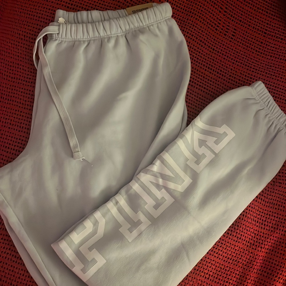 Pink sweat pants light blue size extra large brand new with tags on them